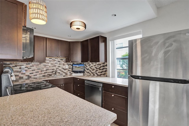 kitchen featuring sink, dark brown cabinetry, backsplash, and appliances with stainless steel finishes