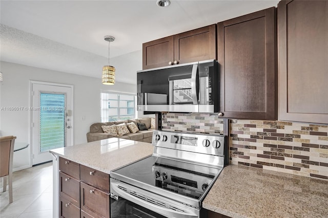 kitchen featuring backsplash, pendant lighting, light stone countertops, and stainless steel appliances