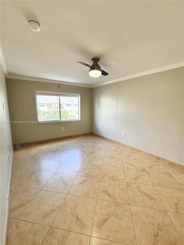 unfurnished room featuring ceiling fan, crown molding, and light tile patterned flooring