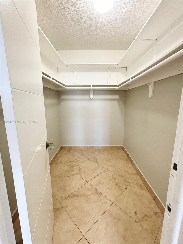 walk in closet featuring light tile patterned floors