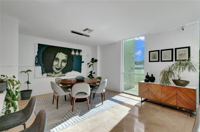 dining room featuring expansive windows