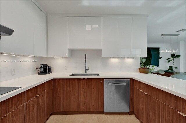 kitchen with dishwasher, backsplash, sink, black electric cooktop, and white cabinetry