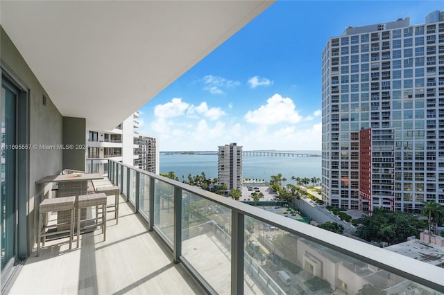 balcony featuring a water view