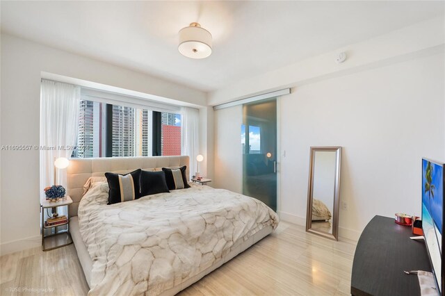 bedroom with light hardwood / wood-style floors