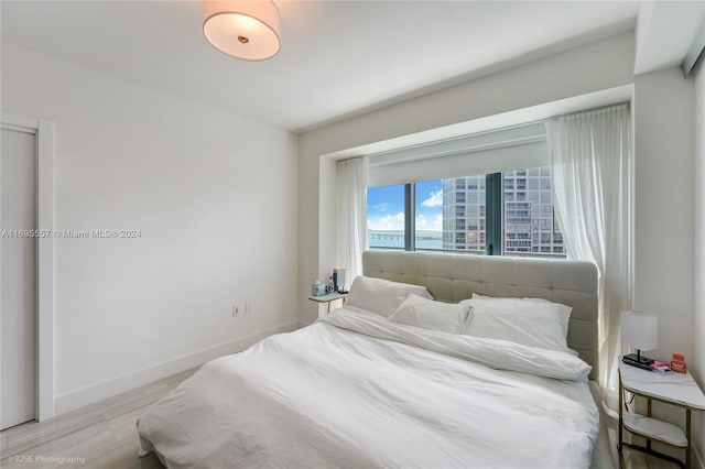 bedroom with light hardwood / wood-style floors