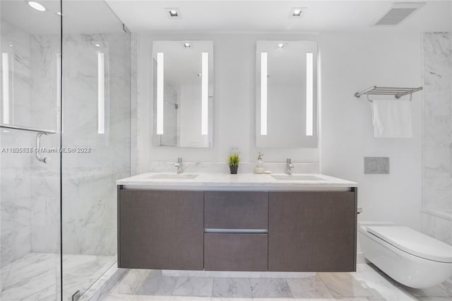 bathroom with tiled shower, vanity, and toilet