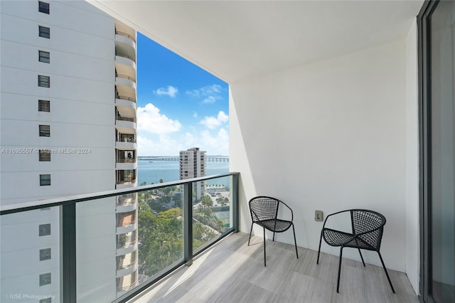 balcony featuring a water view