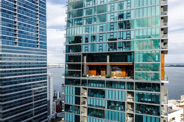 view of building exterior with a water view