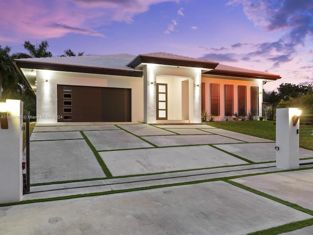 prairie-style home featuring a garage