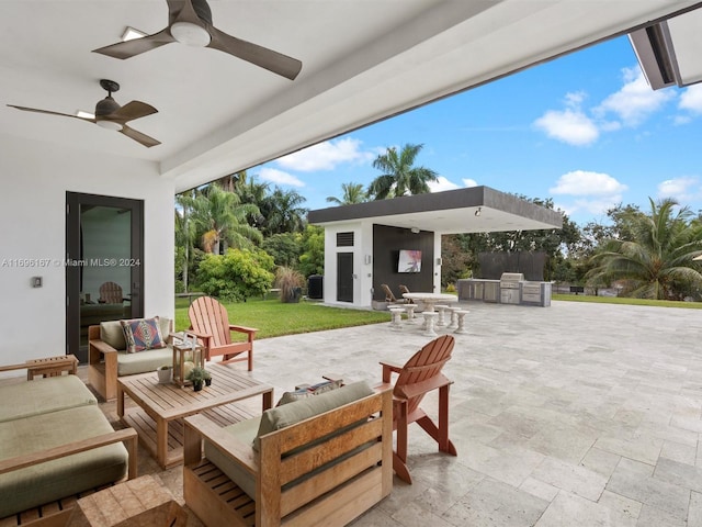 view of patio featuring an outdoor living space, an outdoor kitchen, and ceiling fan