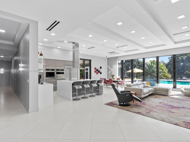 tiled living room with beamed ceiling