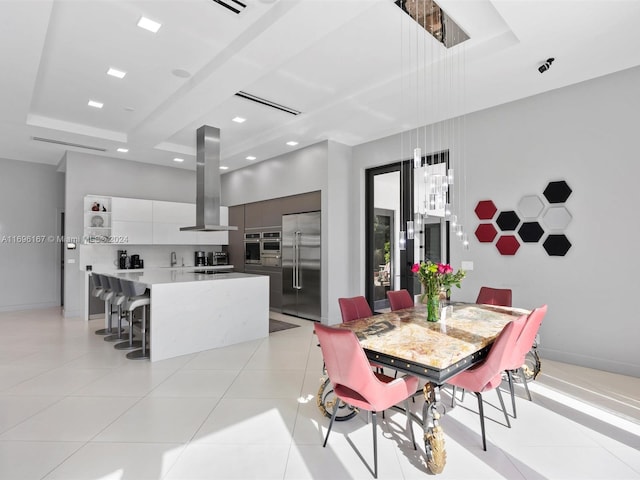 tiled dining area featuring sink