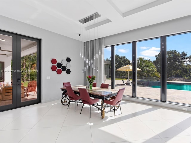 tiled dining area featuring french doors