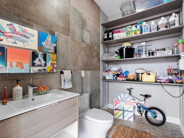 bathroom featuring sink and toilet