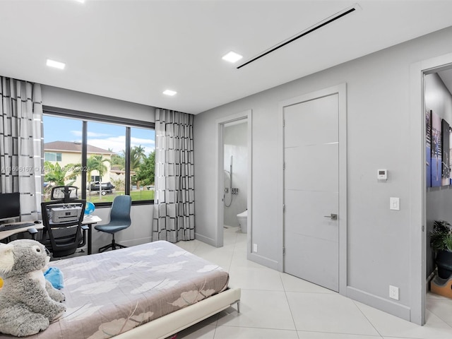 tiled bedroom featuring ensuite bathroom