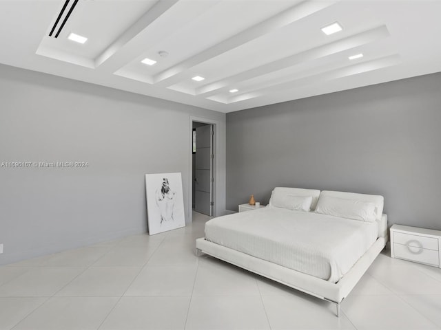 bedroom featuring beam ceiling and light tile patterned floors