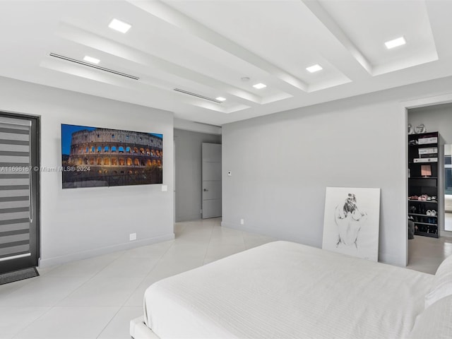 bedroom featuring beamed ceiling and light tile patterned floors