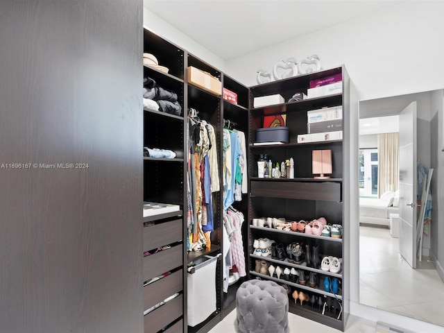 walk in closet featuring light tile patterned floors