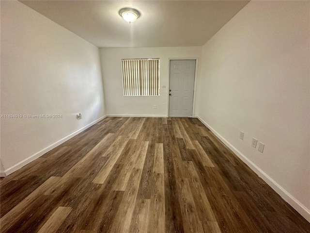 spare room featuring dark hardwood / wood-style floors