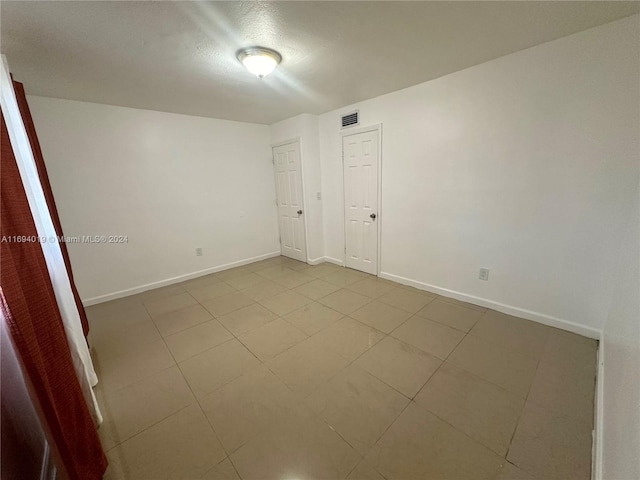 view of tiled spare room