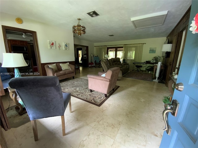 living room featuring an inviting chandelier