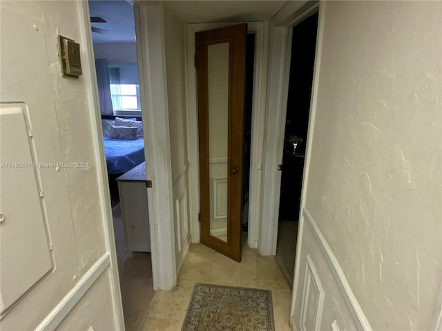 hallway with light tile patterned flooring