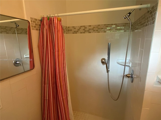 bathroom with a shower with shower curtain