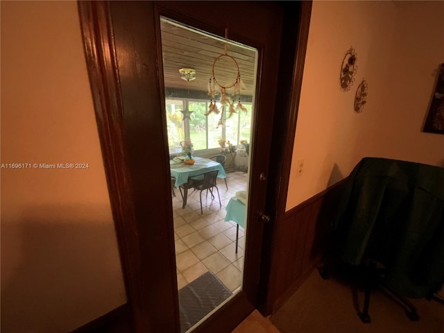 hall featuring light tile patterned flooring