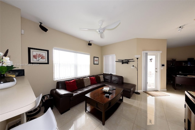 living room featuring ceiling fan and light tile patterned floors