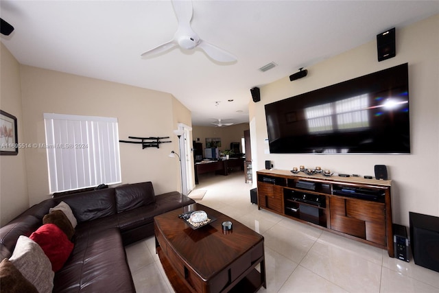 tiled living room with ceiling fan