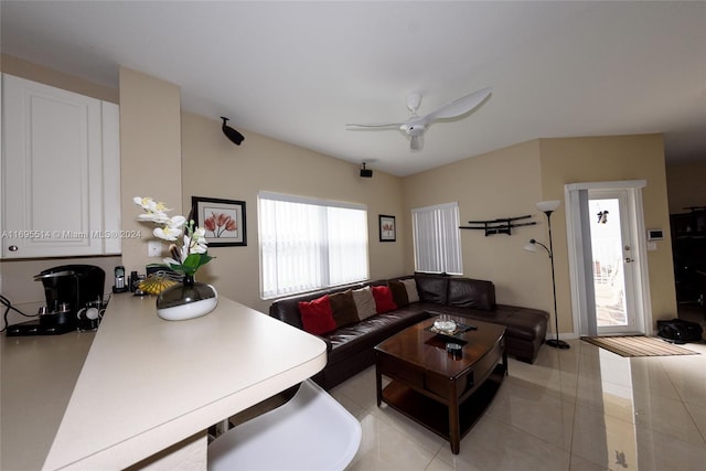 tiled living room featuring ceiling fan