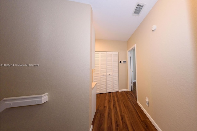 corridor with dark wood-type flooring