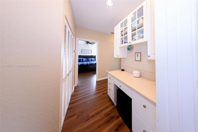 hallway with dark hardwood / wood-style flooring