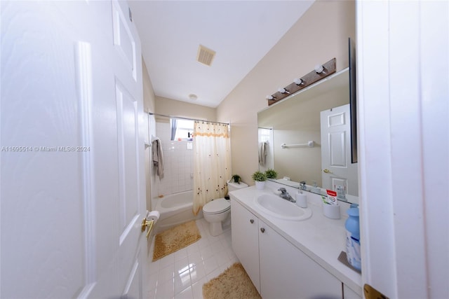 full bathroom featuring shower / bath combo, vanity, vaulted ceiling, tile patterned flooring, and toilet