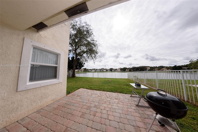 view of patio / terrace featuring a grill and a water view