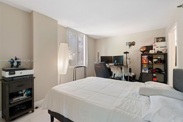 bedroom featuring light tile patterned floors