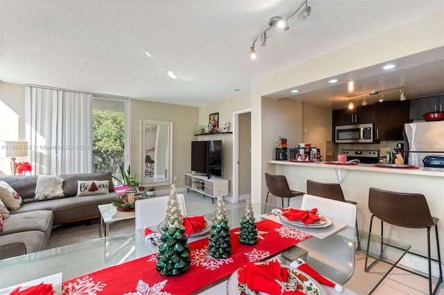 dining room featuring rail lighting