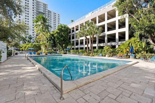 view of swimming pool featuring a patio