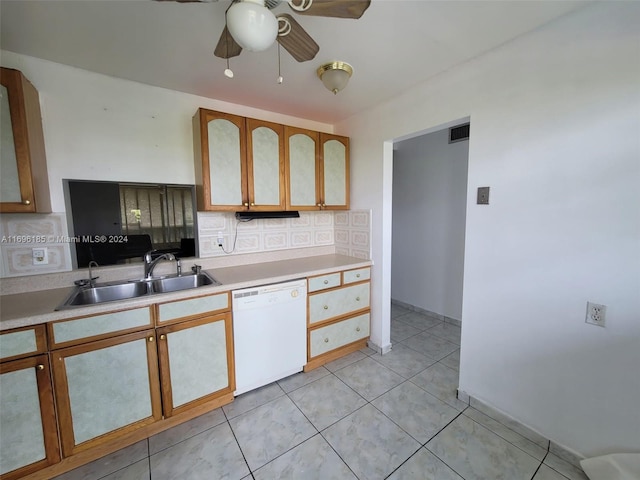 kitchen featuring ceiling fan, sink, backsplash, white dishwasher, and light tile patterned floors