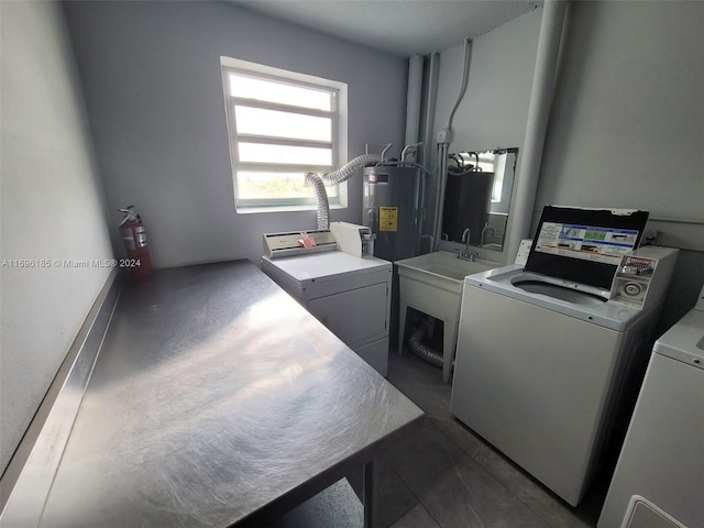 laundry area featuring washer and clothes dryer and water heater