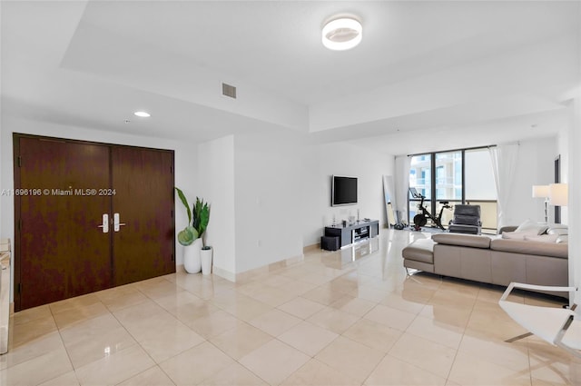 living room with light tile patterned floors