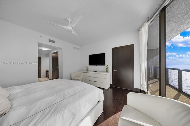 bedroom with ceiling fan and dark hardwood / wood-style flooring