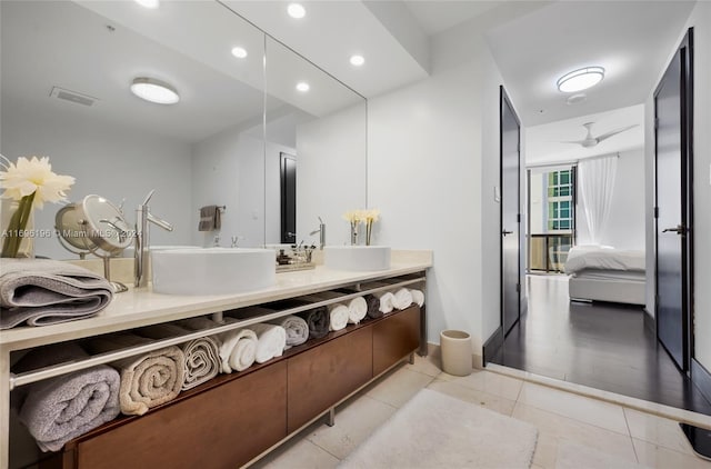 bathroom featuring tile patterned floors, ceiling fan, and vanity