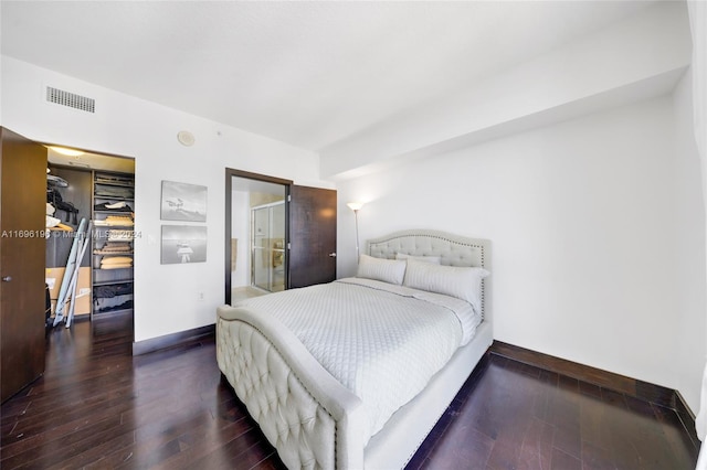 bedroom featuring dark hardwood / wood-style floors