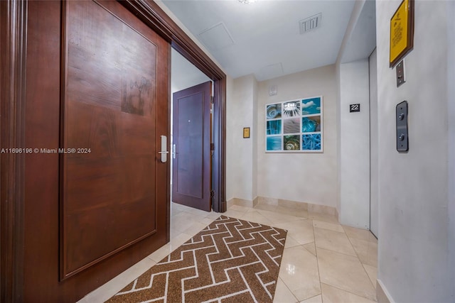 hallway with light tile patterned floors