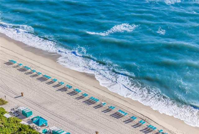 aerial view featuring a water view and a view of the beach