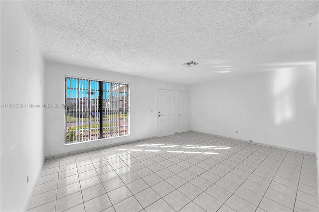 view of tiled spare room