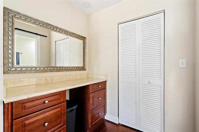 bathroom featuring vanity and hardwood / wood-style flooring