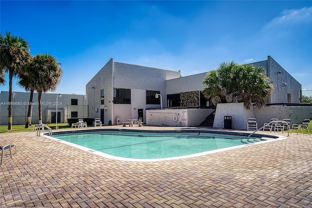 view of pool featuring a patio