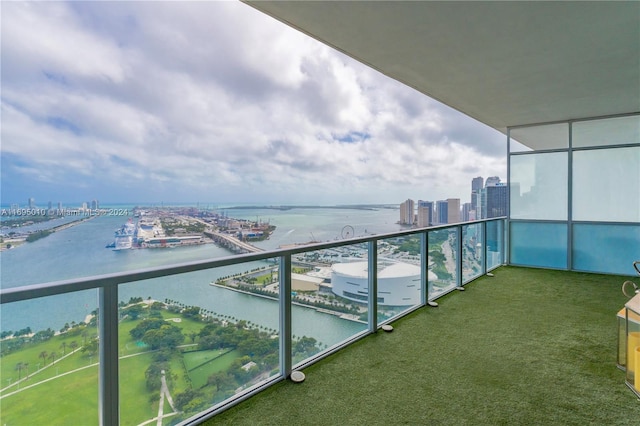 balcony featuring a water view